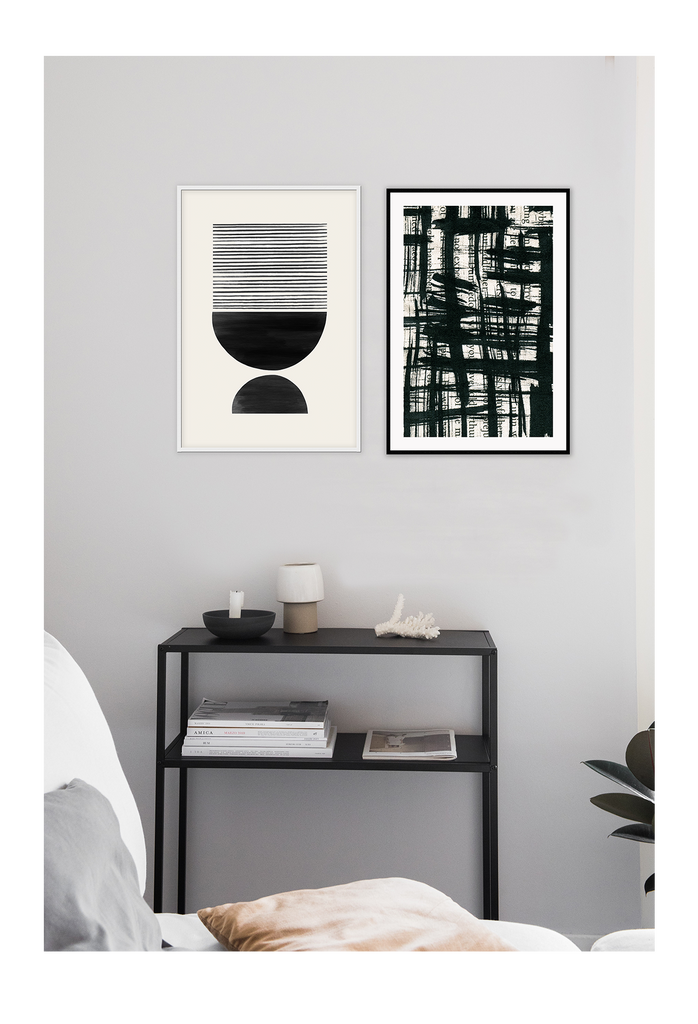 Black and white abstract symmetrical print with half circles and lines on a beige background 