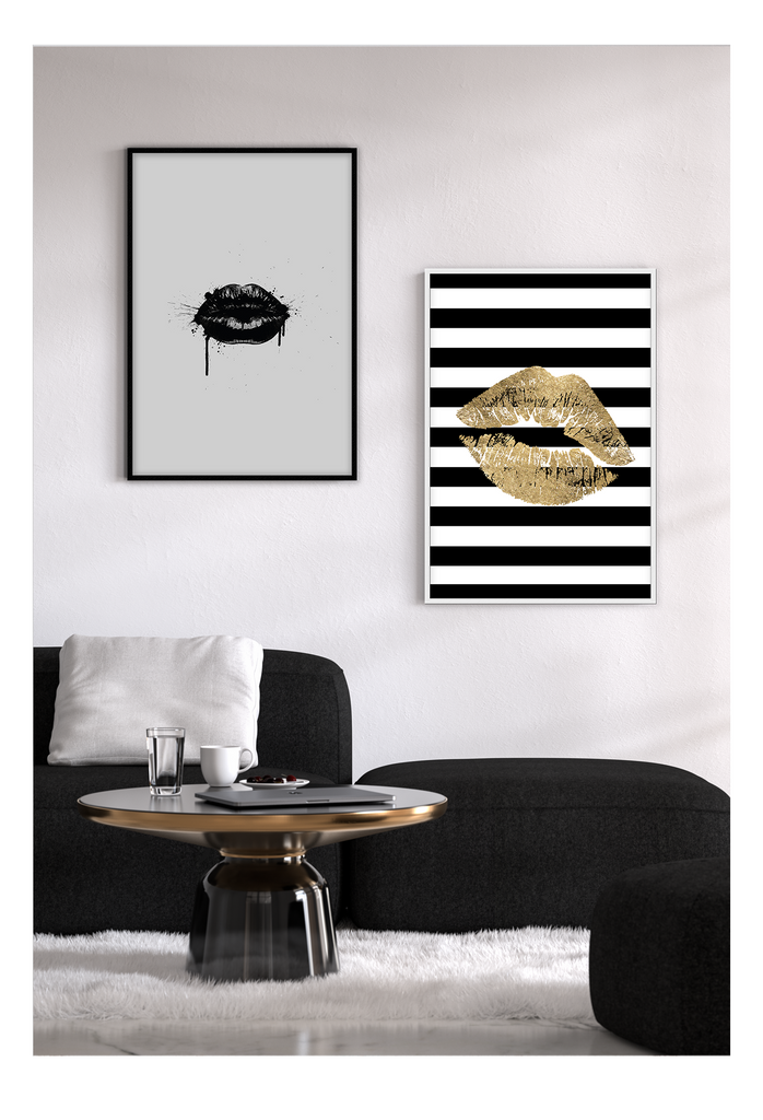 Fashion print with a gold kiss print on a black and white striped background. 