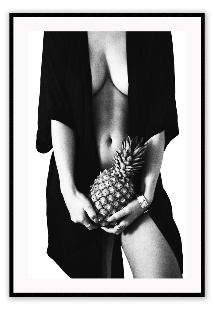 Fashion photography print with nude sexy woman wearing robe holding pinapple in black and white on white background 