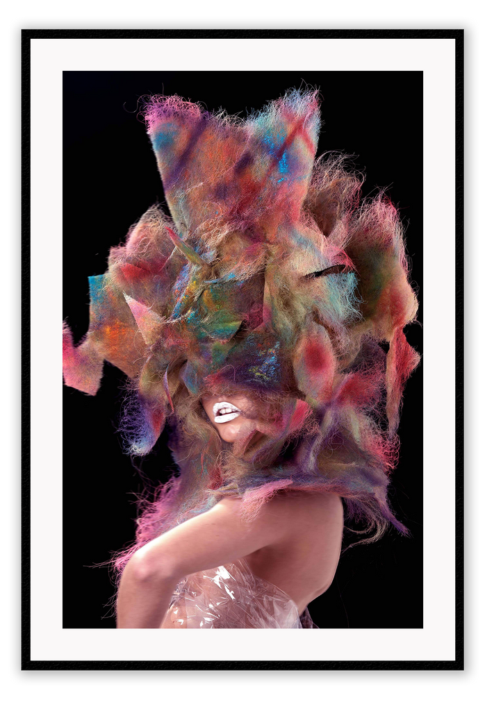 A fashion wall art with a sexy fashion model in colourful translucent plastic dress with wild bright hair. 