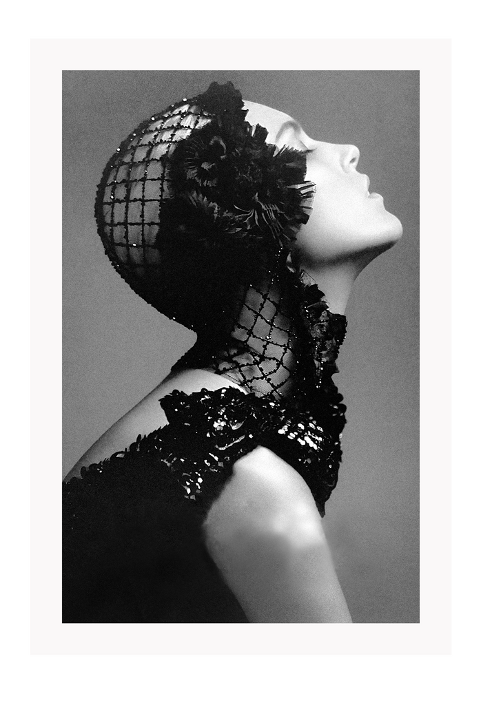 A black and white, vintage fashion wall art with Coco chanel woman wearing black lace flower. 