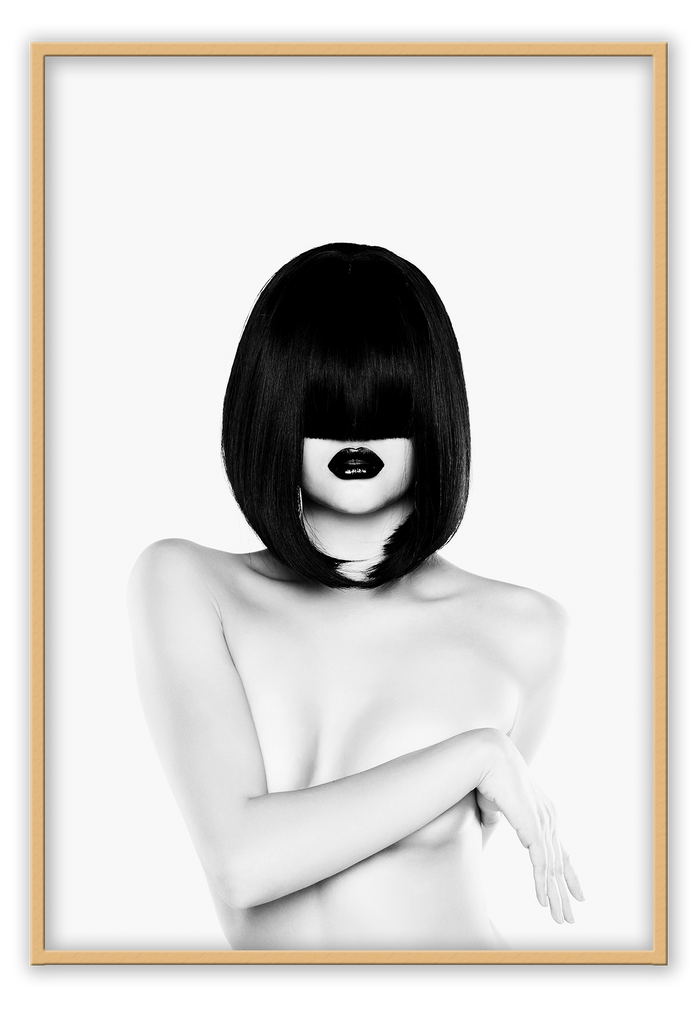 A black and white fashion wall art with a nude women figure with black straight hair.