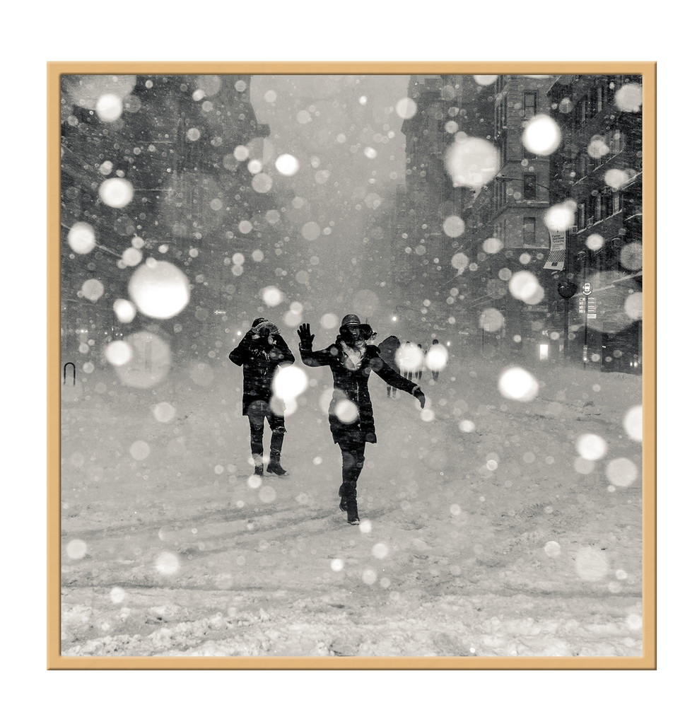 Square print black and white couple having a snow ball fight in winter throwing photography  