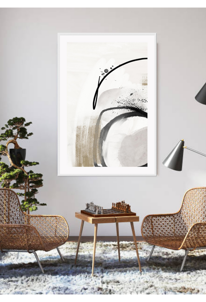 Abstract art print with linear black brushtrokes and chunky beige strokes complemented by paint splatters on white background