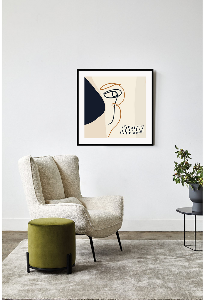 Abstract art print with black dots, shapes and squiggly lines complemented by a beige squiggly line on a cream background.