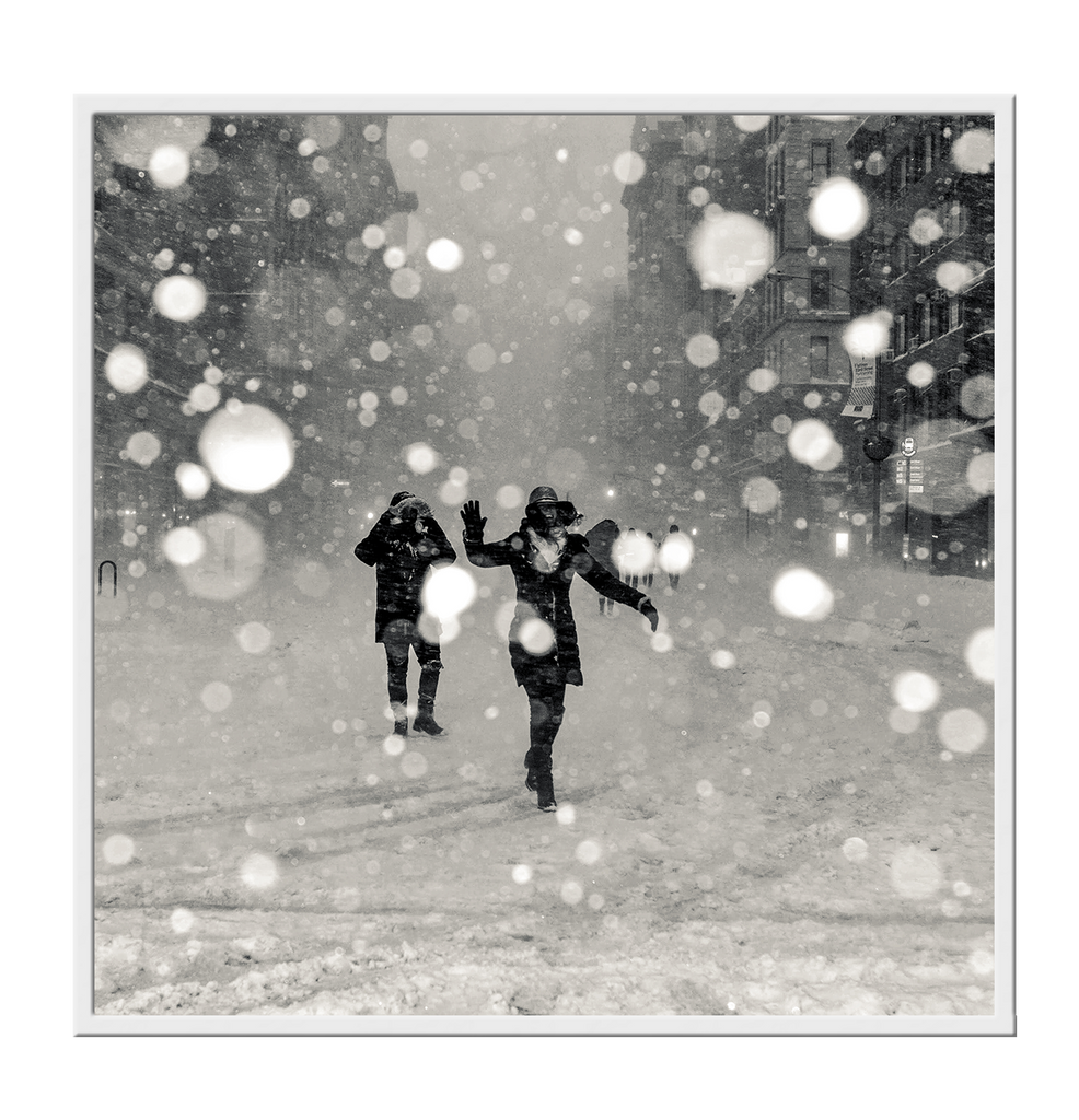 Square print black and white couple having a snow ball fight in winter throwing photography  