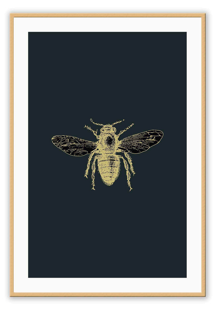 A natural wall art with brass bee on navy blue background that mimics an insect sample