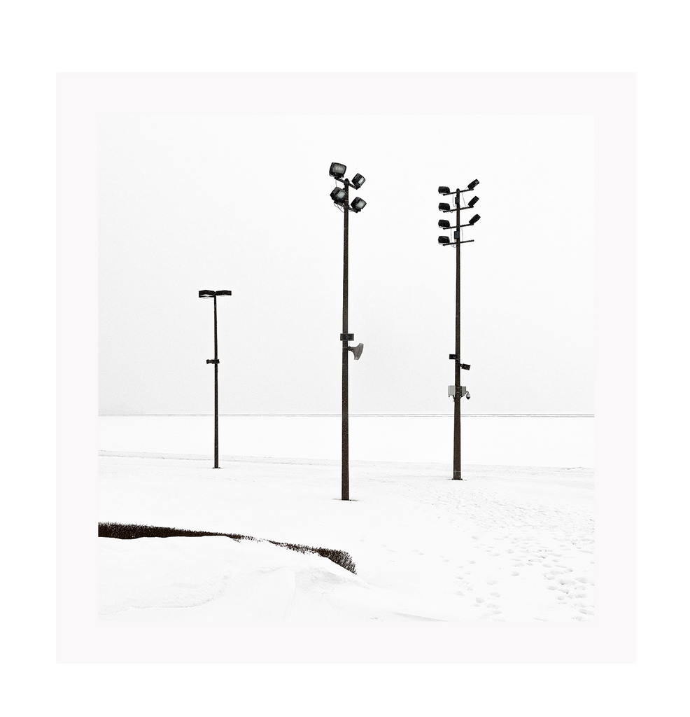 Minimal winter print with white background and black street lights.