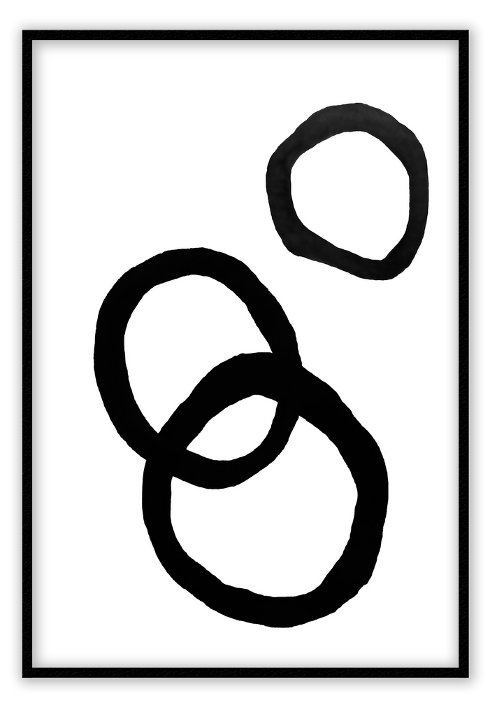 An abstract black and white wall art with black ink rings.