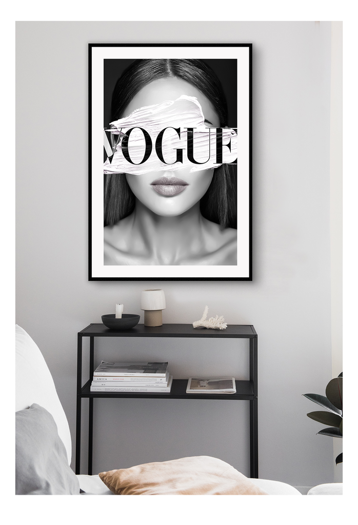A fashion wall art of a fashion female model and white stripe on eyes and Vogue fashion label. 