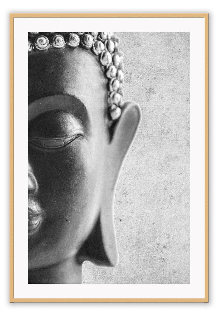 Photography print of black and white buddha half of face with textured grey background