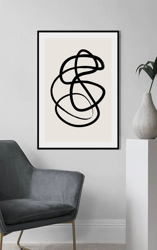 Abstract black and white squiggle print with textured black line and cream background 