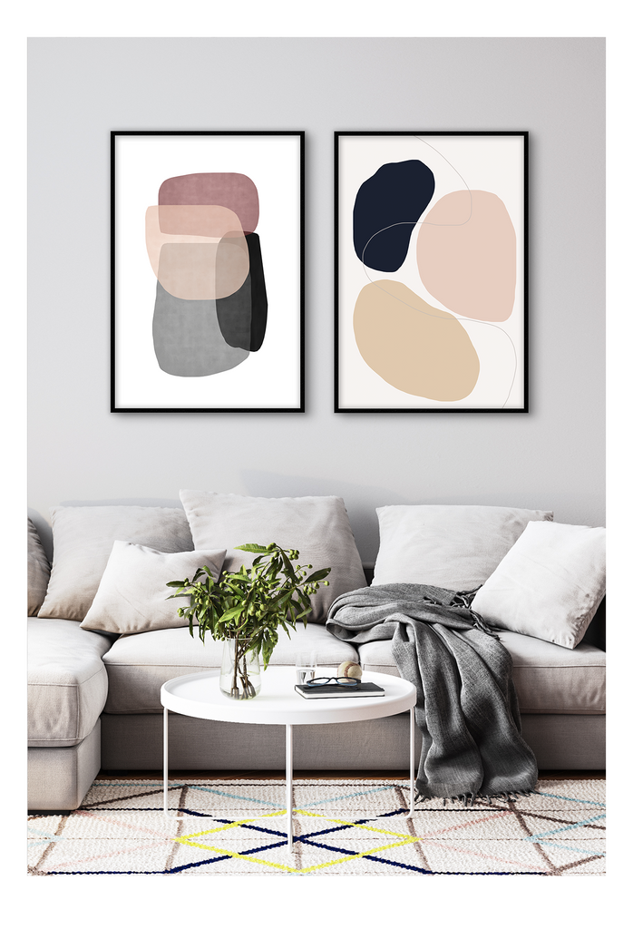 An abstract wall art with navy, pink and beige curvey shapes on white background. 