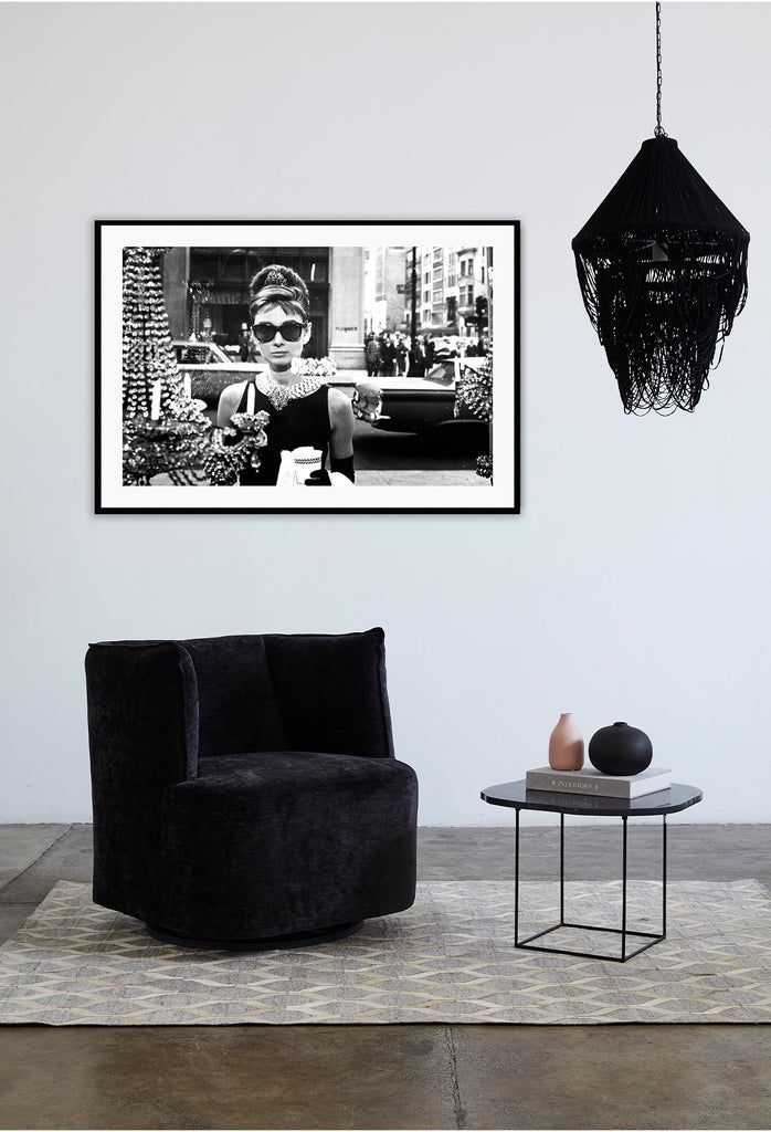 A vintage black and white cinematic wall art with iconic movie star Audrey Hepburn  in Breakfast at Tiffany's movie