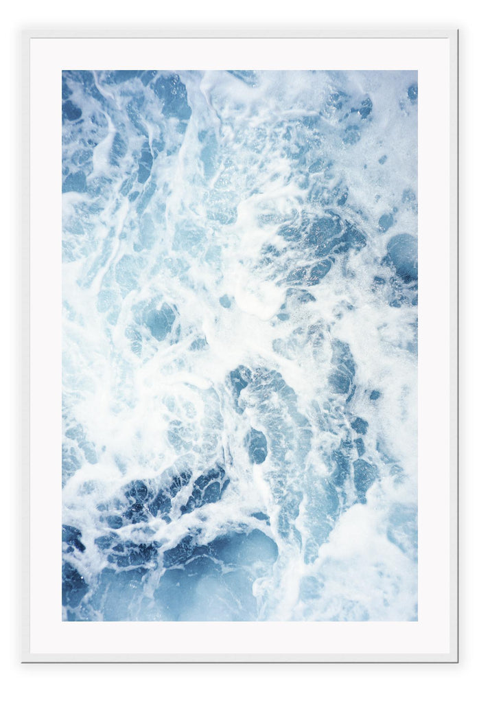 Ocean print with a close-up of the blue sea and white wash. 